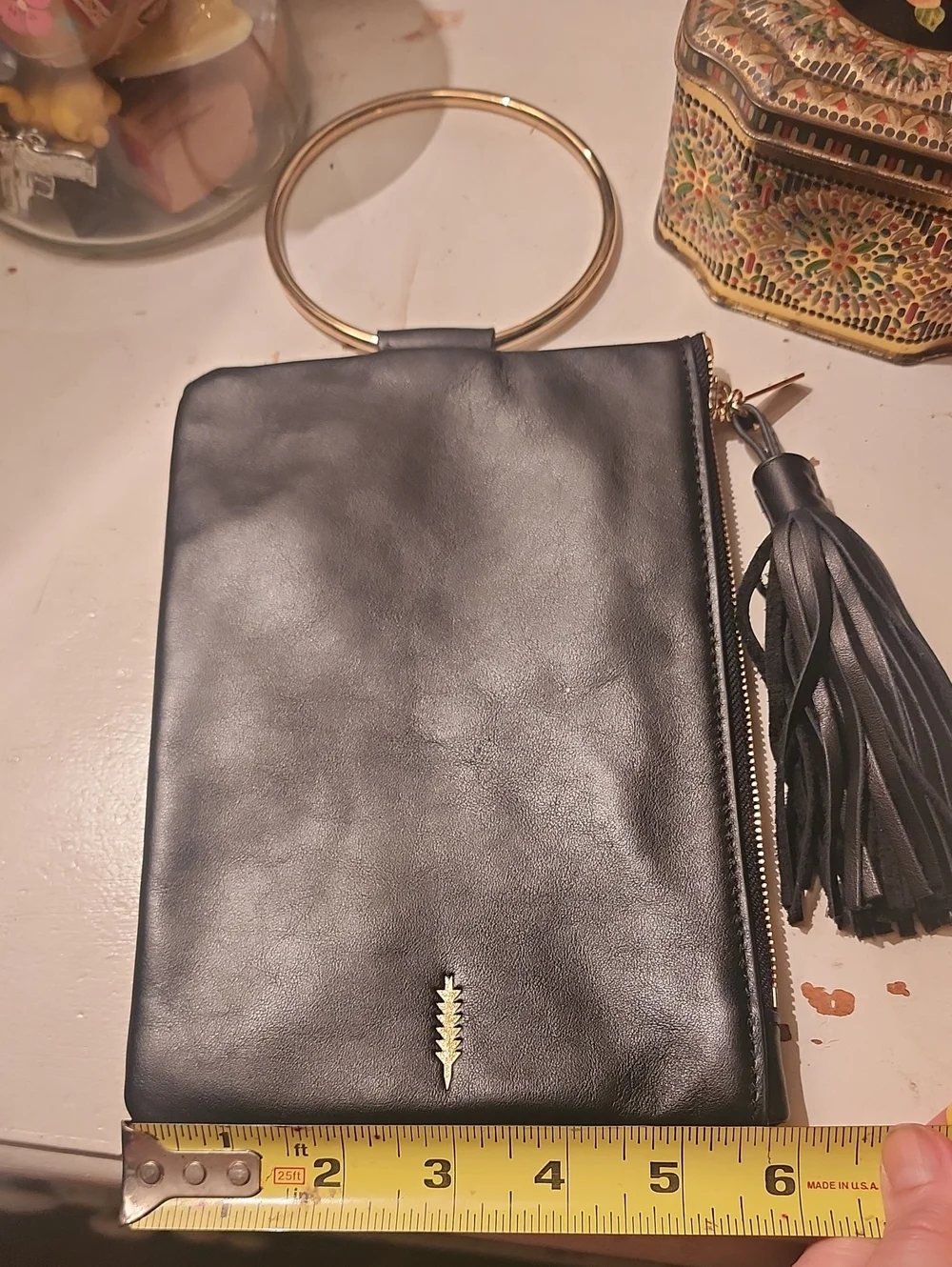 Thacker Black Leather Wristlet Clutch with Gold Ring Handle